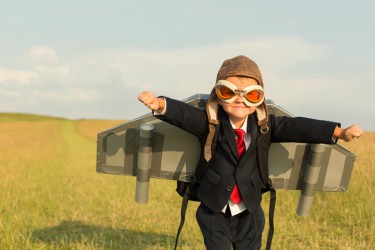 Young Boy Businessman Wearing Jetpack in England